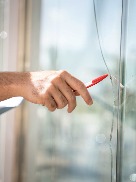 glass-broken-from-house-by-accident-man-checking-repair