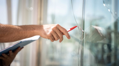 glass-broken-from-house-by-accident-man-checking-repair